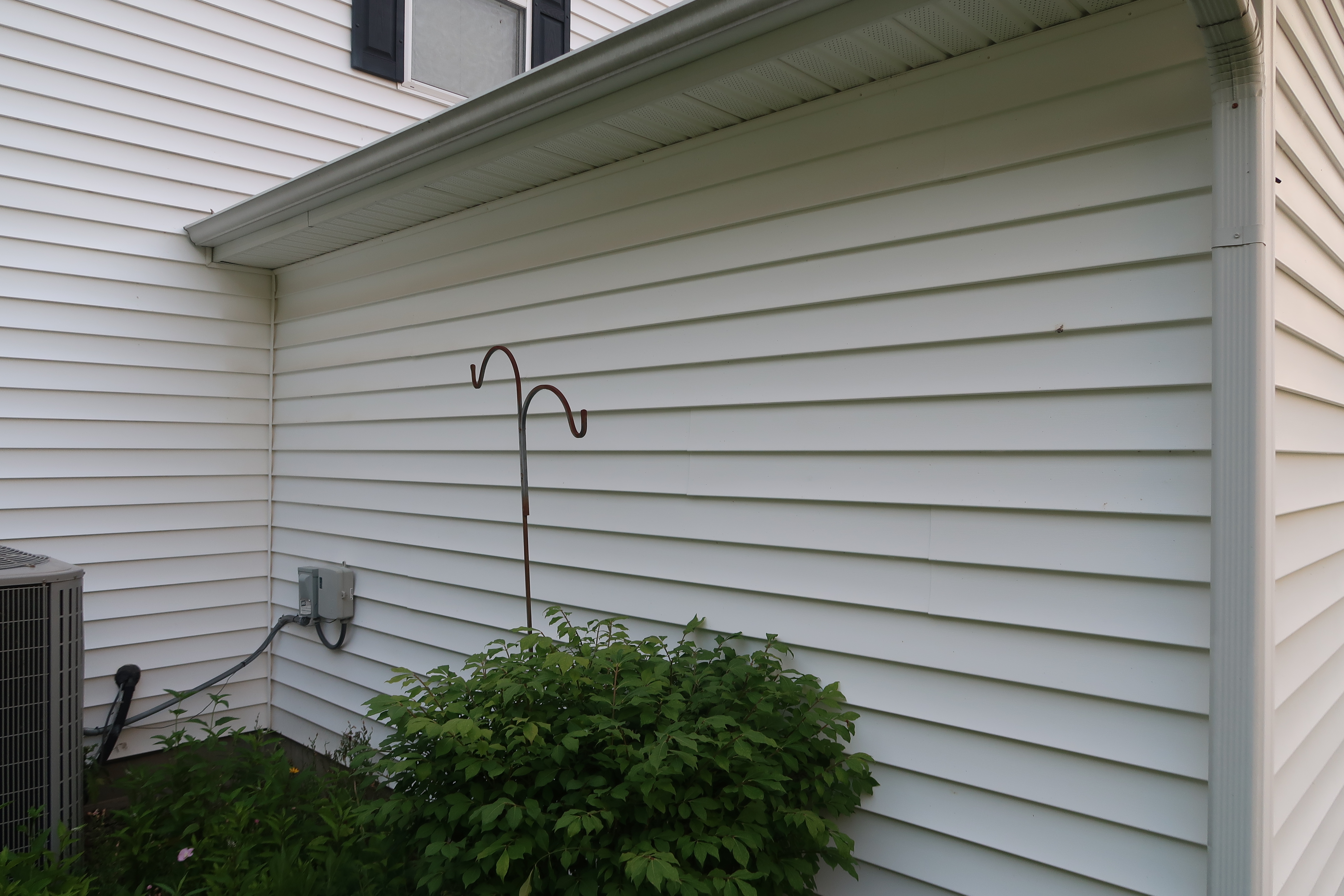 House siding with mold before washing