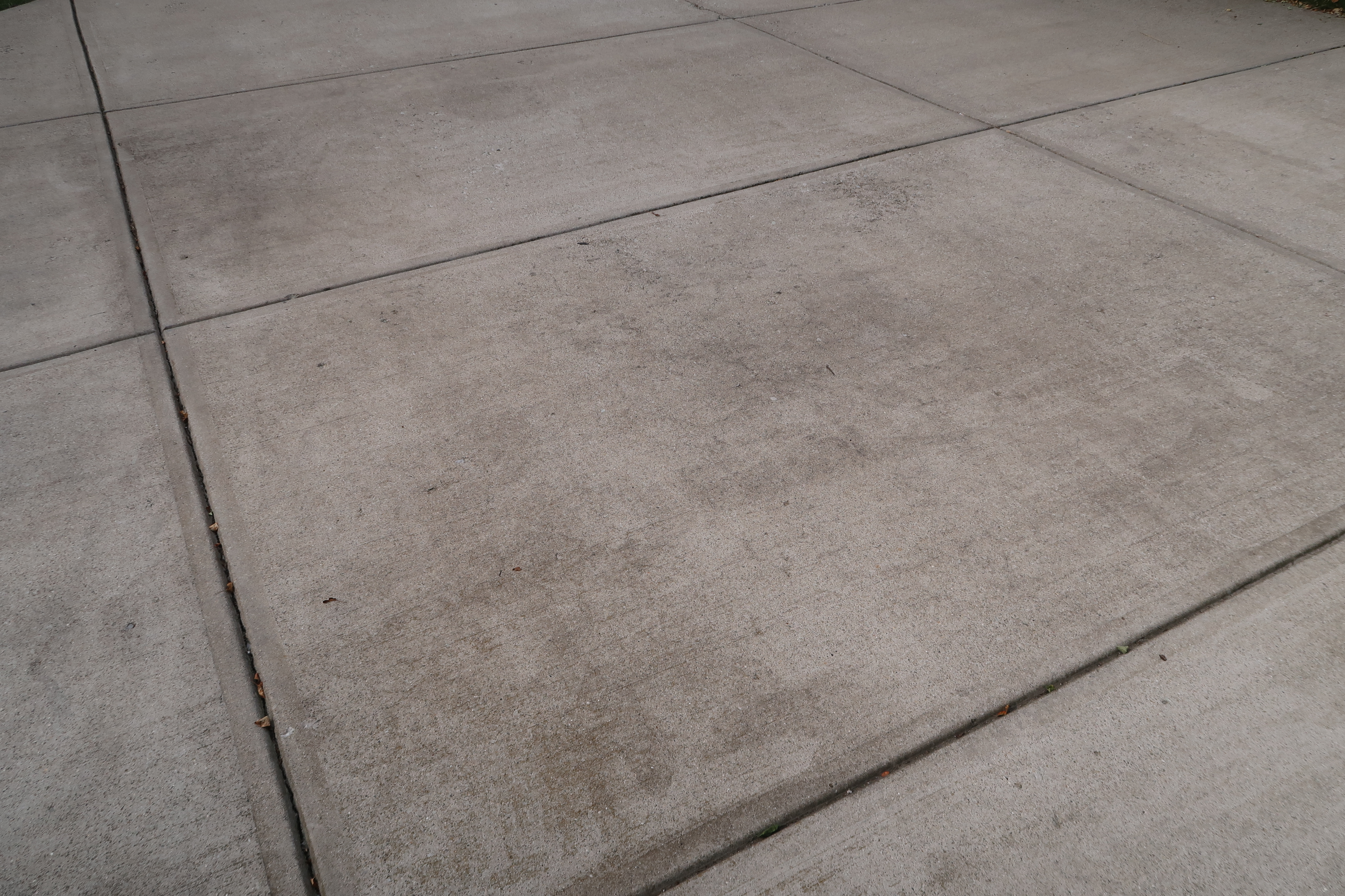 Dirty concrete surface before cleaning