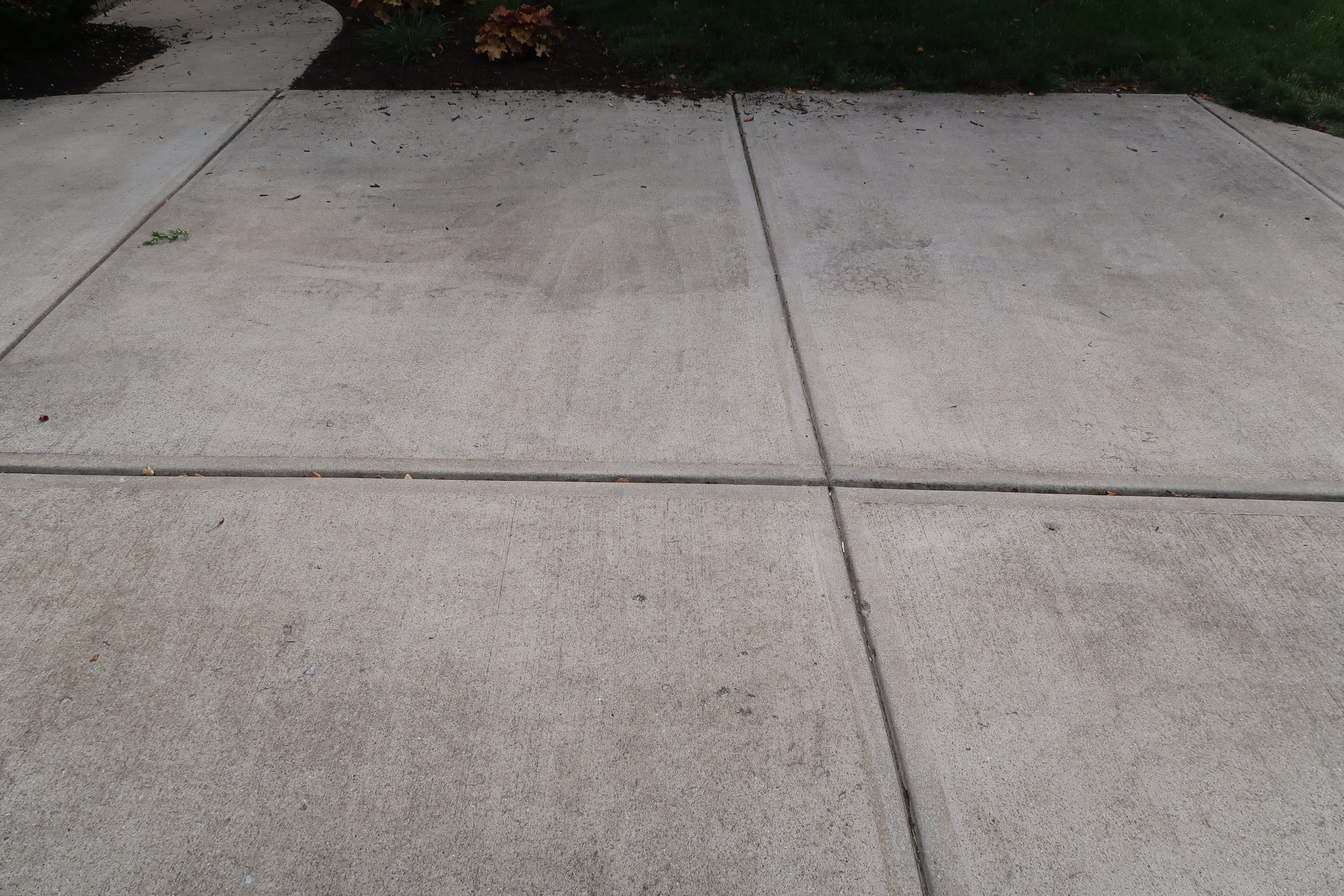 Stained concrete before pressure washing