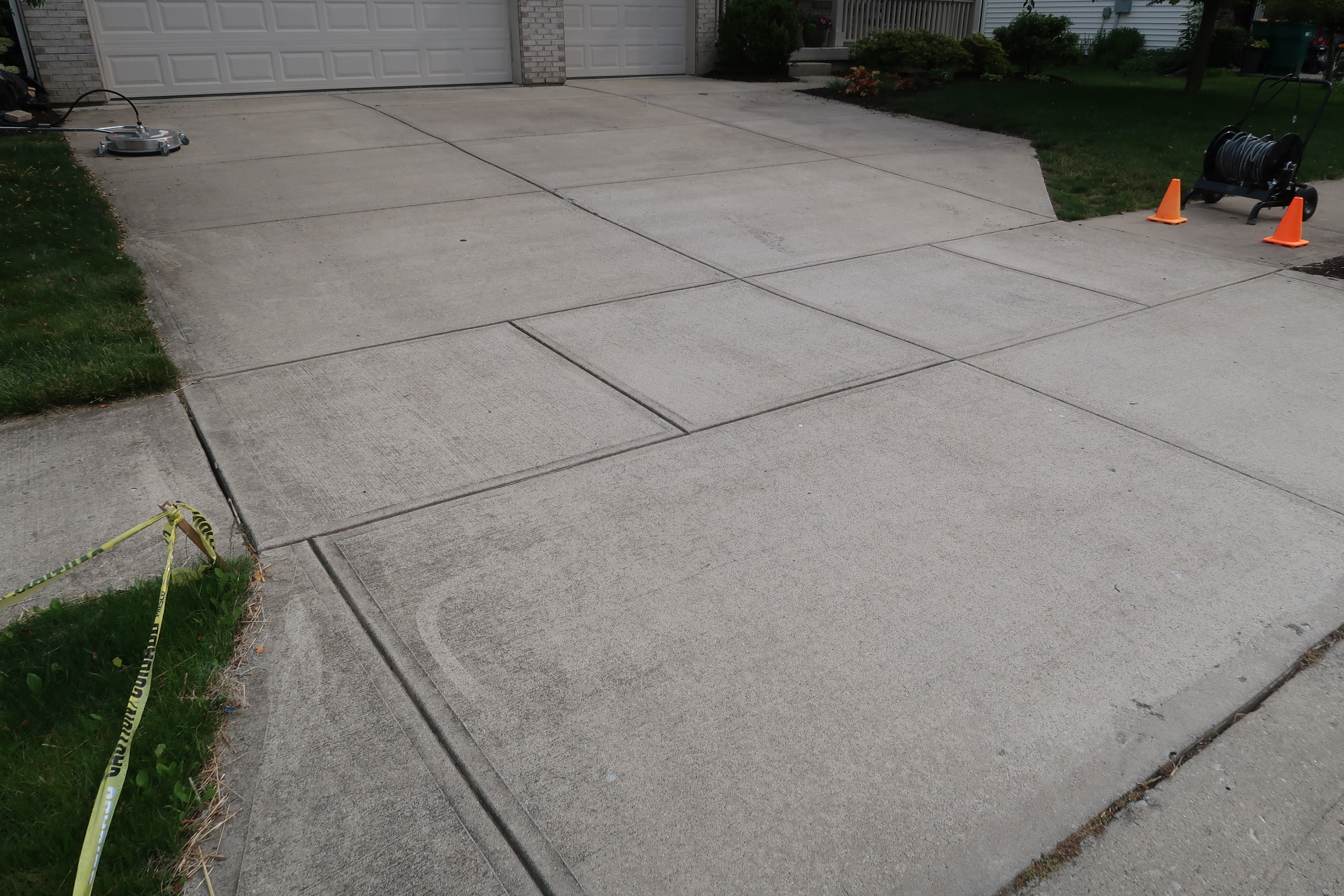 Driveway surface cleaning in progress