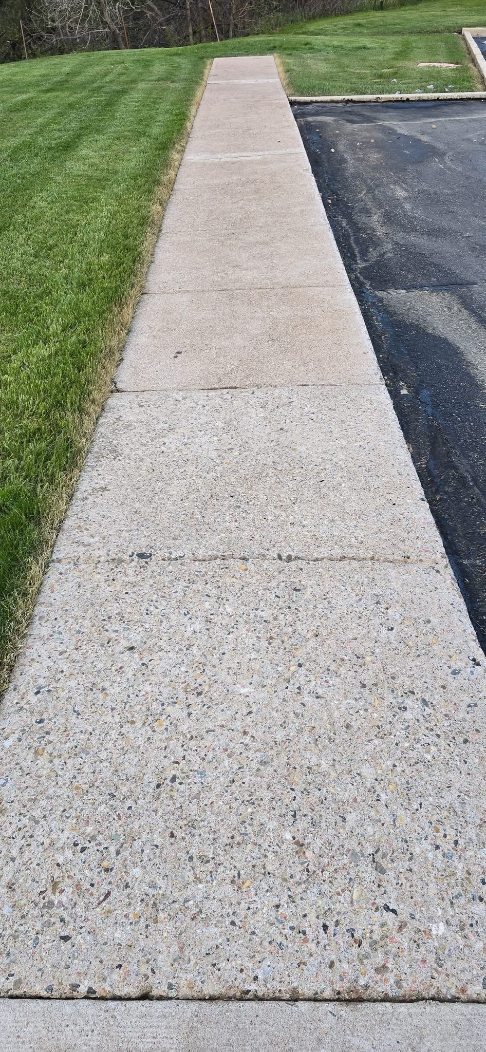 Clean residential sidewalk after surface cleaning