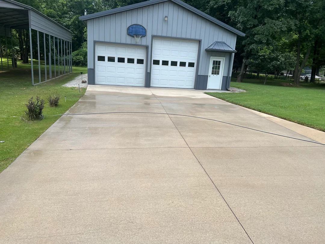 Stained driveway before pressure washing