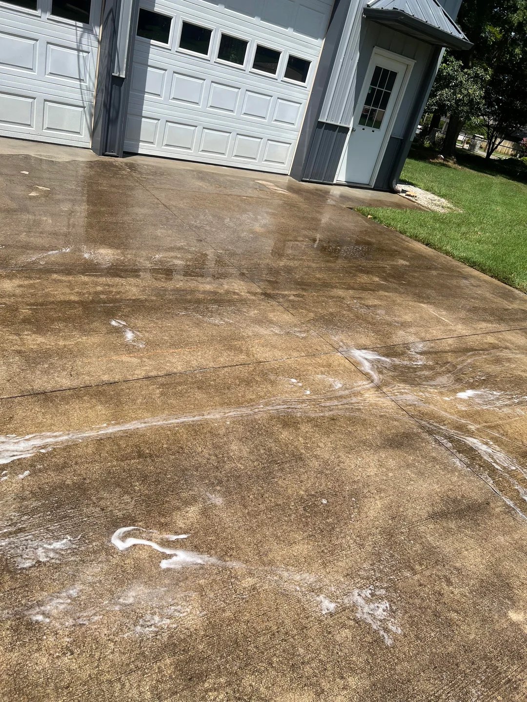 Driveway during pressure washing treatment