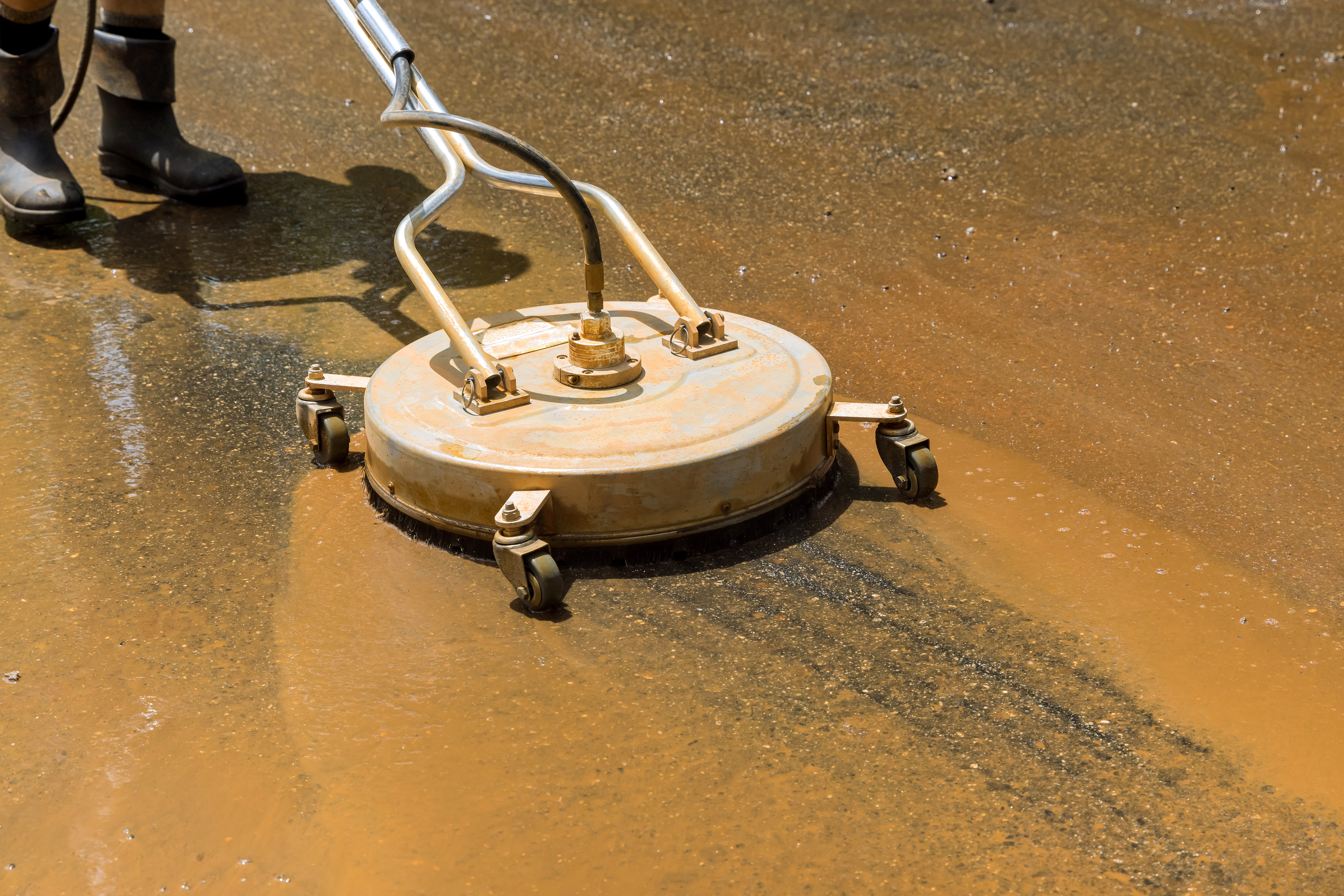 Rotary surface cleaner on concrete