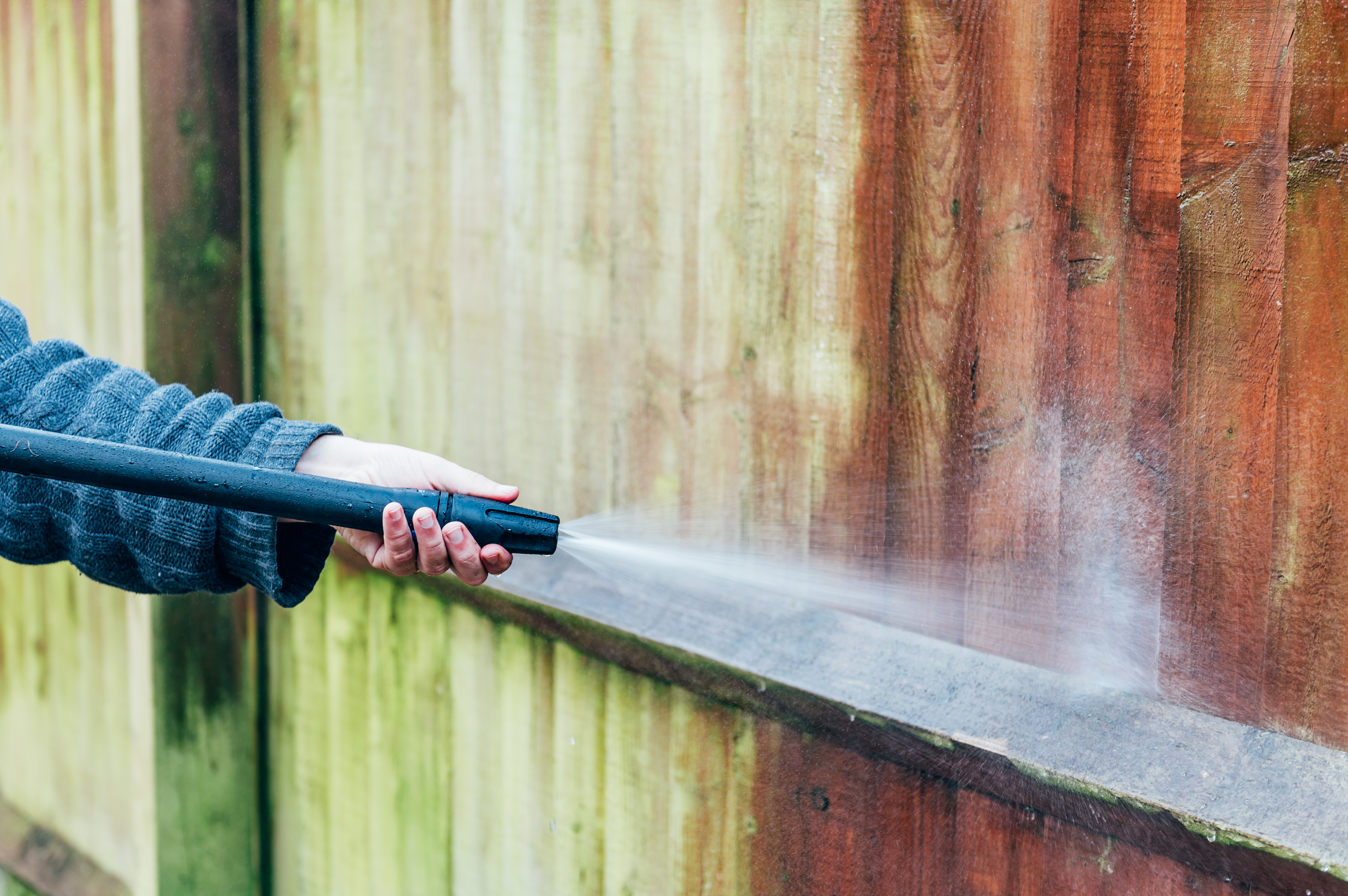 Power washing wooden fence